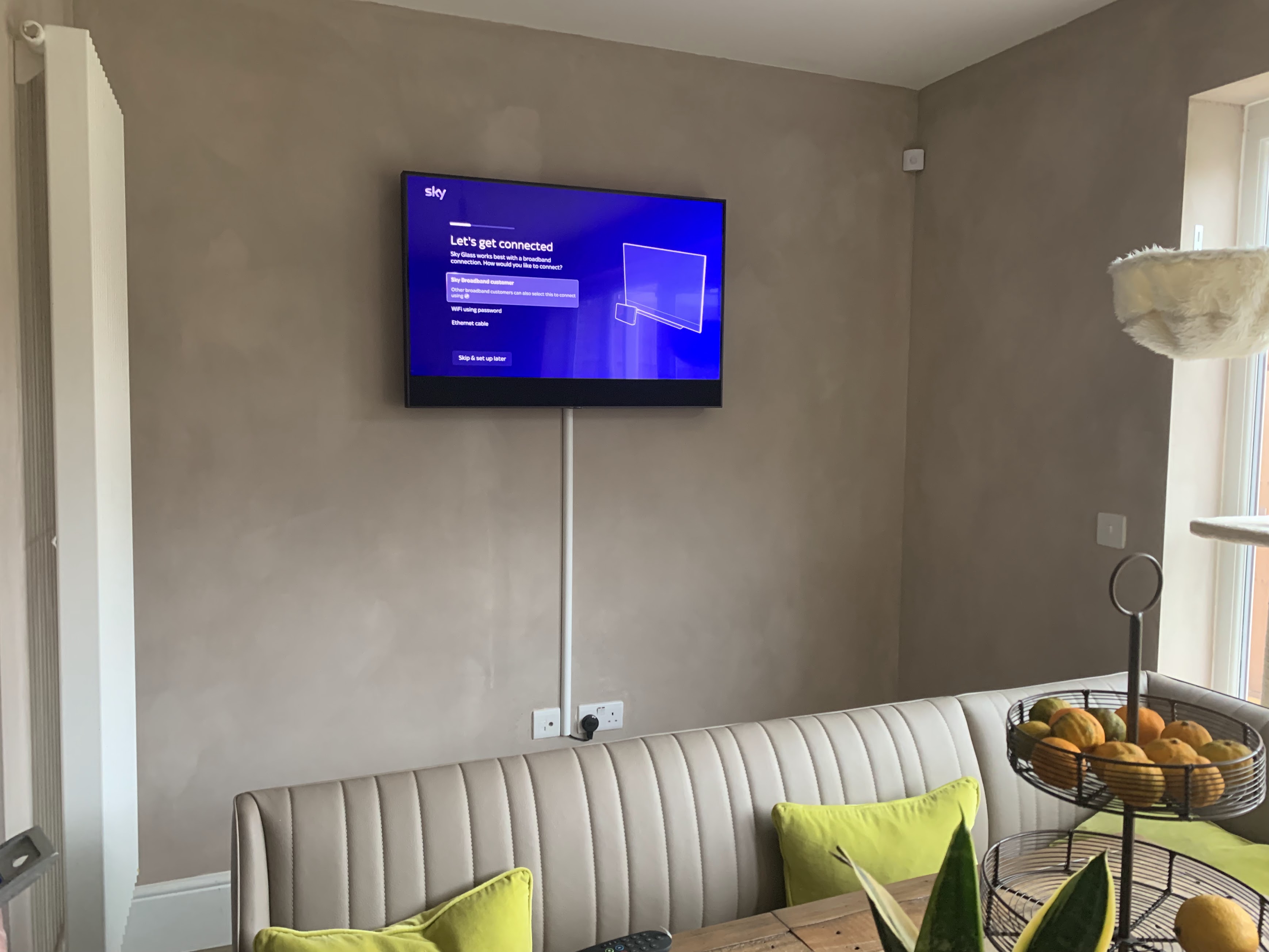 Completed TV wall mount installation with Sky Glass